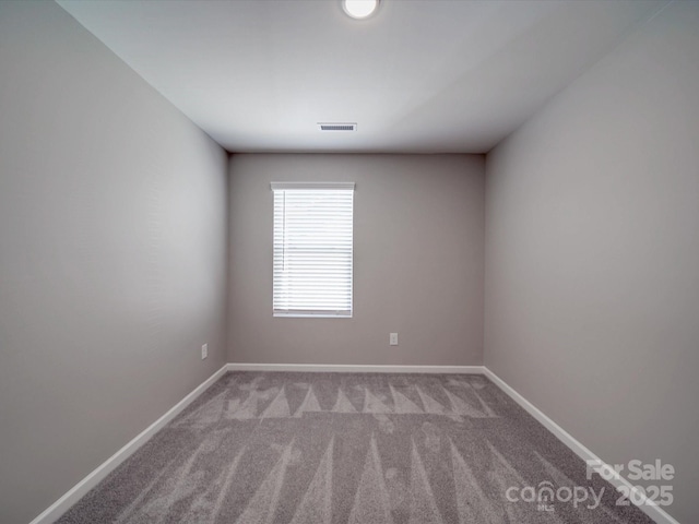 empty room featuring light carpet