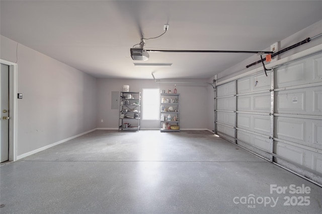 garage featuring baseboards and a garage door opener