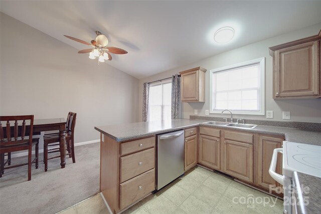 kitchen with electric range, stainless steel dishwasher, vaulted ceiling, a sink, and a peninsula