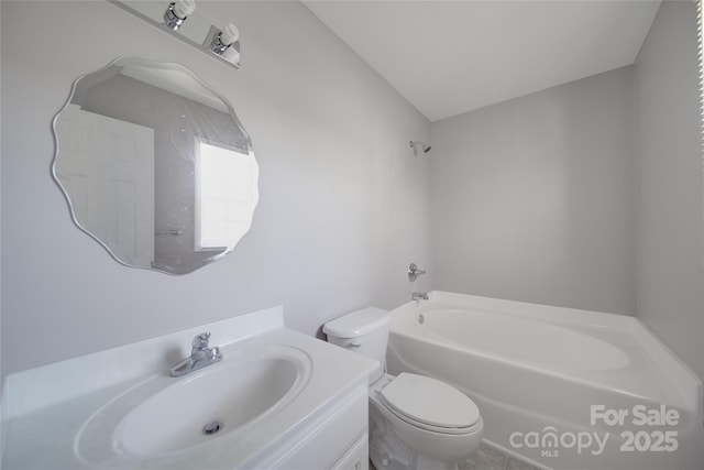 bathroom with vanity, toilet, and a bath