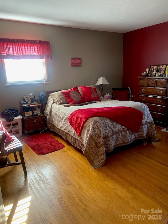 bedroom with wood finished floors