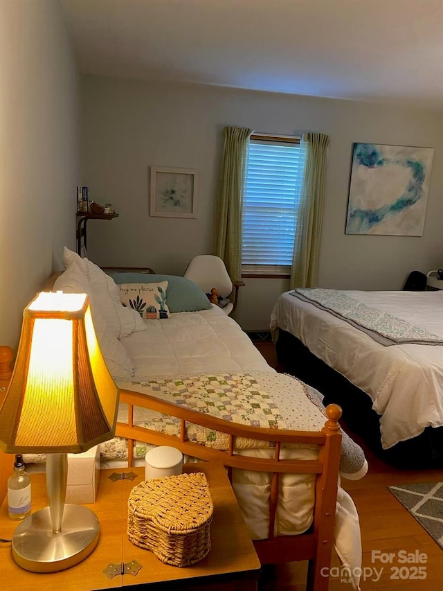 bedroom featuring wood finished floors