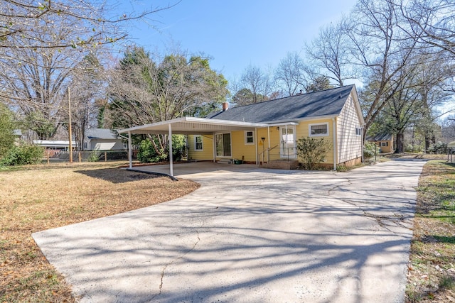 view of front of home with a carport