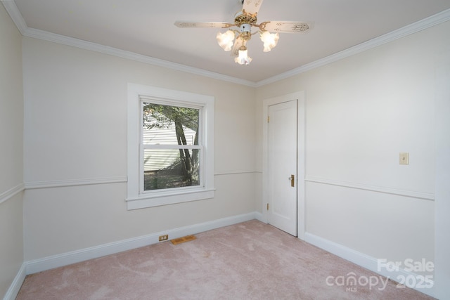 unfurnished room featuring light carpet, crown molding, and ceiling fan