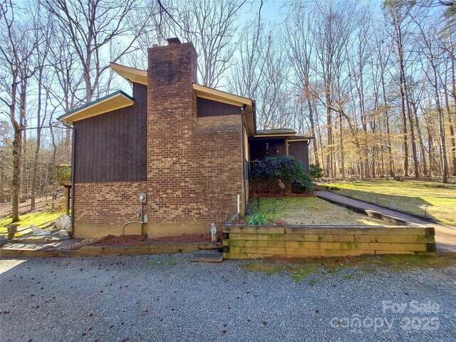 8015 Sullivan Dr Unit 3And 2, Charlotte, NC 28215 - view of side of home with a chimney and brick siding