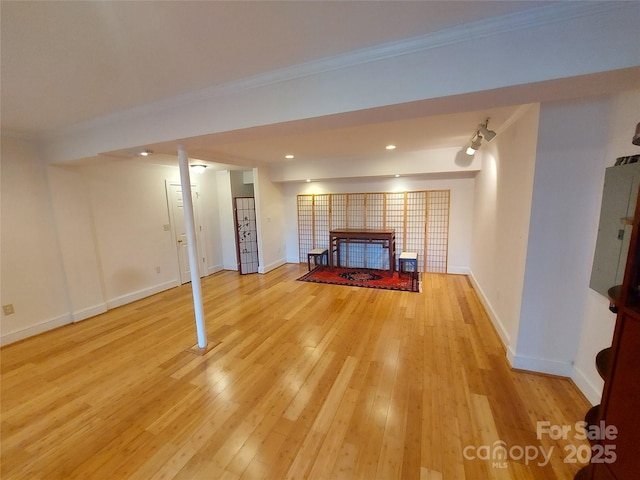 8015 Sullivan Dr Unit 3And 2, Charlotte, NC 28215 - unfurnished living room with light wood-style flooring, a tiled fireplace, baseboards, recessed lighting, and ornamental molding