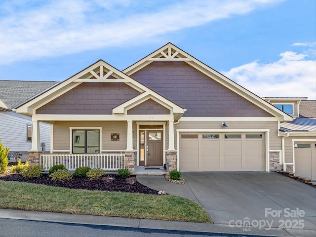 craftsman house featuring a garage and covered porch