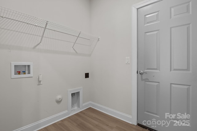 washroom with laundry area, wood finished floors, baseboards, gas dryer hookup, and washer hookup