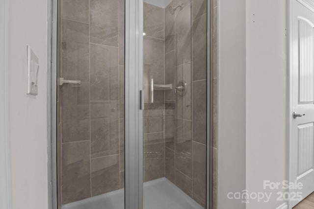 full bath with a shower stall
