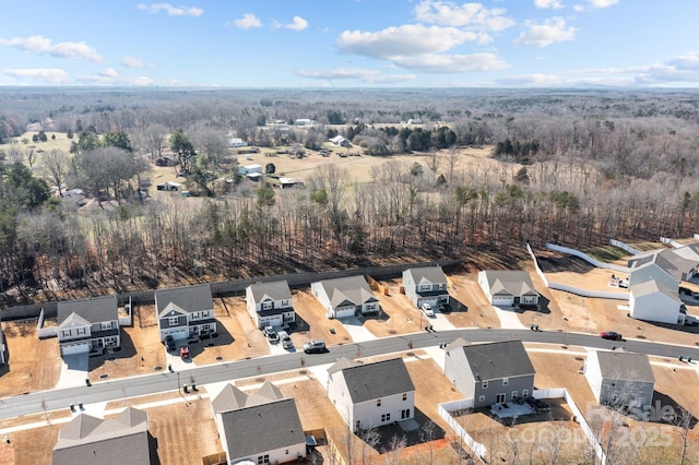 bird's eye view featuring a view of trees and a residential view