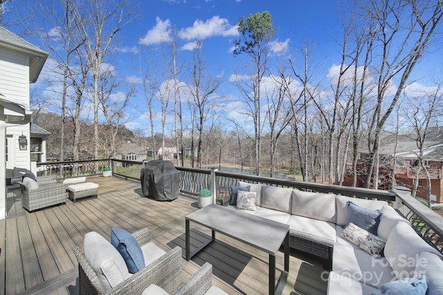 wooden deck featuring area for grilling and outdoor lounge area