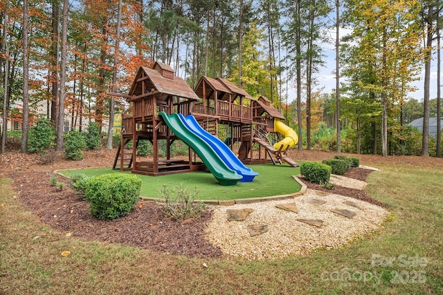 communal playground featuring a yard