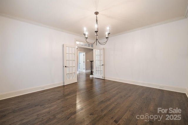 unfurnished dining area with baseboards, dark wood-type flooring, crown molding, french doors, and a chandelier