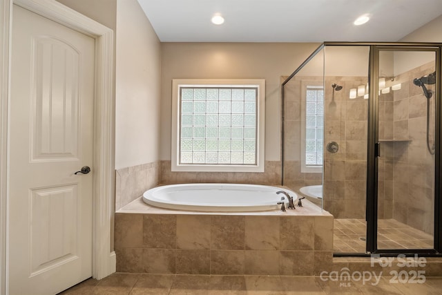 bathroom featuring a stall shower, recessed lighting, a bath, and tile patterned floors