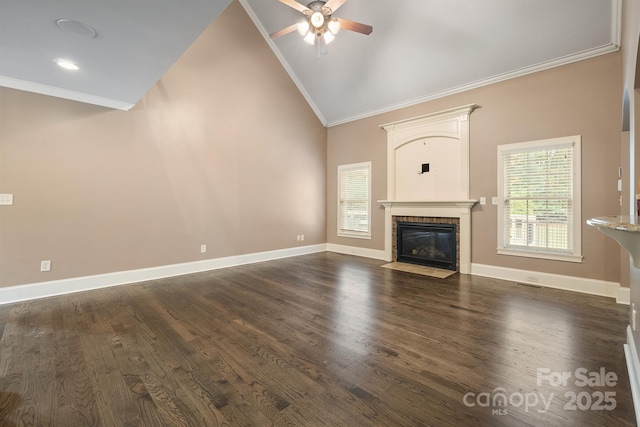 unfurnished living room featuring crown molding, a fireplace with flush hearth, dark wood-type flooring, high vaulted ceiling, and baseboards