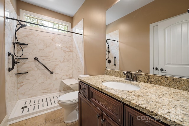 full bath featuring toilet, a shower stall, tile patterned flooring, and vanity