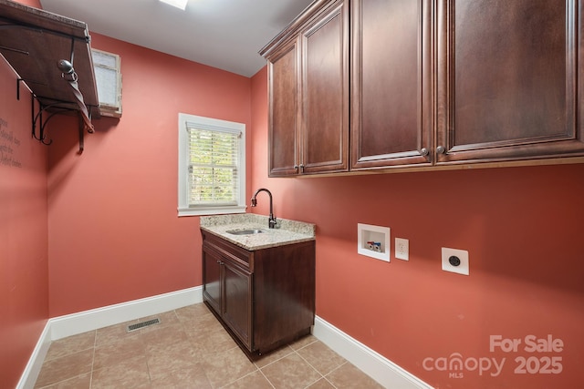 laundry room featuring washer hookup, a sink, visible vents, cabinet space, and electric dryer hookup