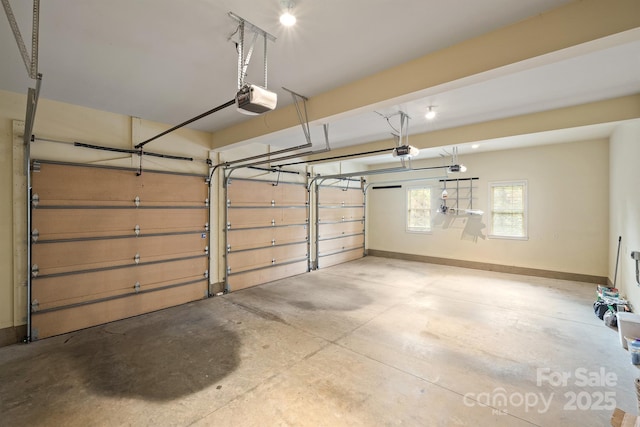 garage featuring baseboards and a garage door opener