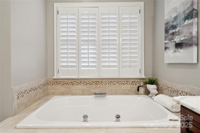 bathroom featuring a bath and vanity