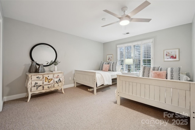 carpeted bedroom with ceiling fan, visible vents, and baseboards