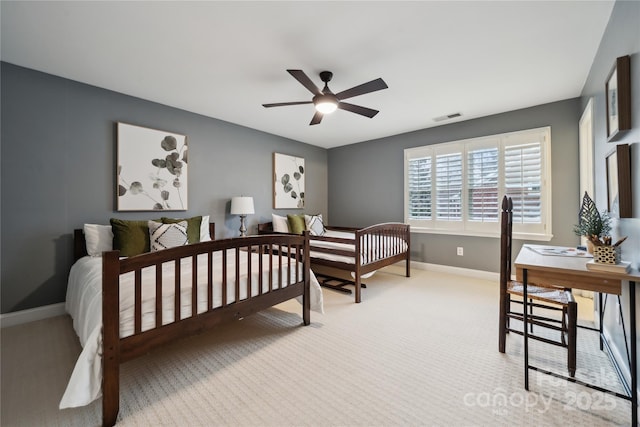 bedroom featuring light carpet, baseboards, and visible vents