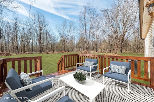 wooden deck featuring a yard