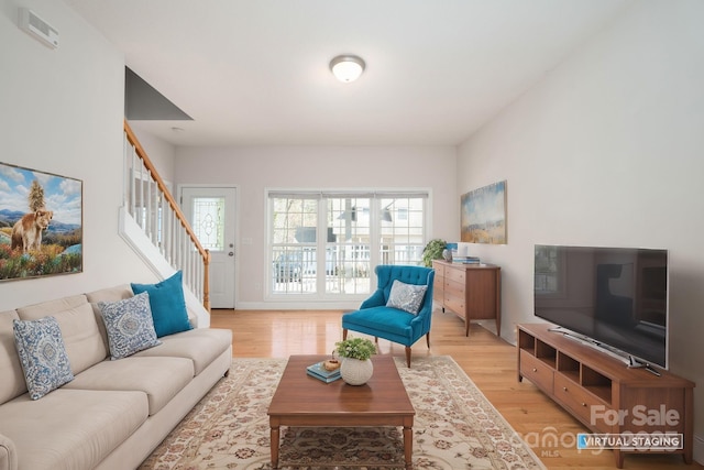 living room with light hardwood / wood-style flooring