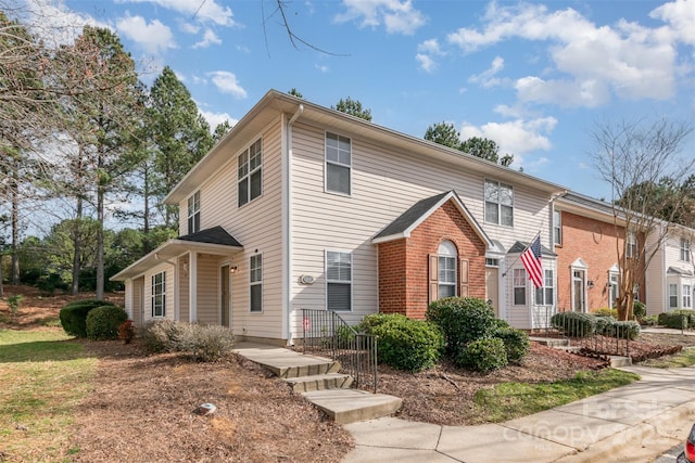 view of front of house with brick siding