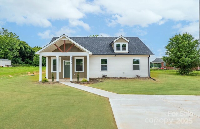 2867 W Zion Church Rd, Shelby, NC 28150 - view of front facade with a front yard, roof with shingles, and covered porch