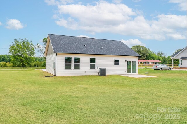 2867 W Zion Church Rd, Shelby, NC 28150 - back of house with a lawn, roof with shingles, a patio, and central air condition unit