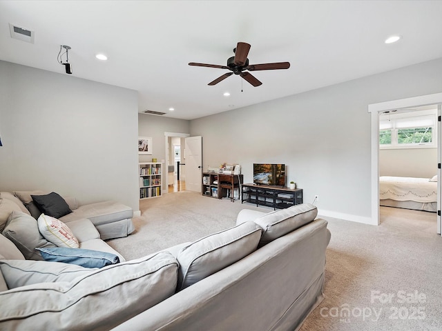 living room with light colored carpet and ceiling fan