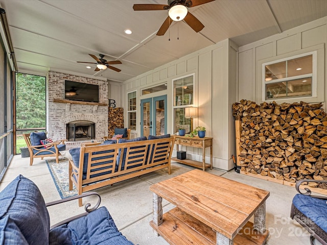 exterior space with french doors, ceiling fan, and an outdoor brick fireplace