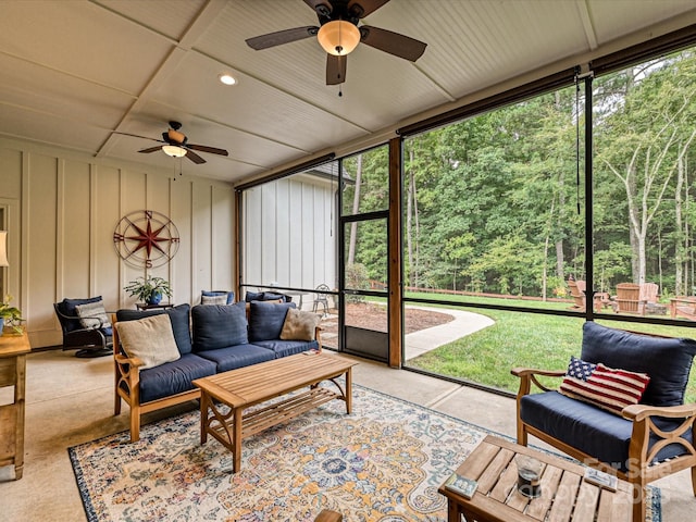 sunroom featuring ceiling fan