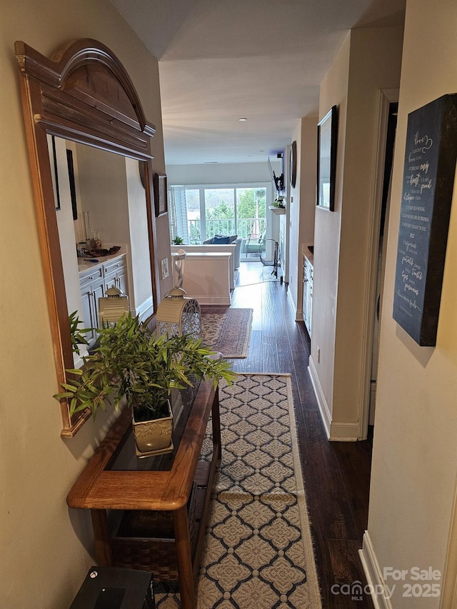 hall with dark hardwood / wood-style floors