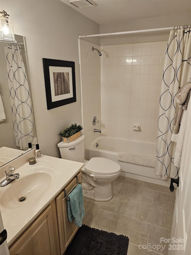 full bathroom featuring vanity, shower / tub combo with curtain, and toilet