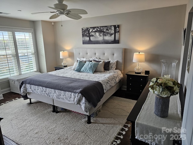 bedroom featuring dark hardwood / wood-style floors and ceiling fan