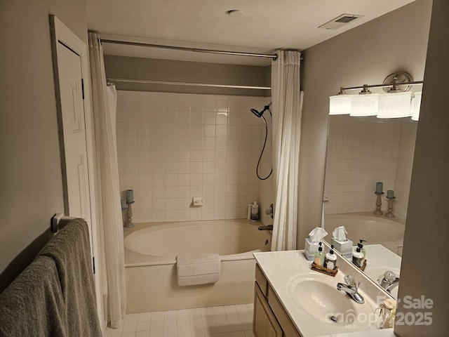 bathroom with vanity, shower / bath combination with curtain, and tile patterned floors