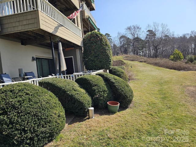 view of yard with a balcony