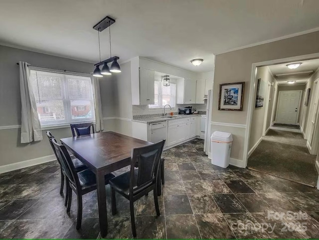 dining space featuring stone finish flooring and baseboards