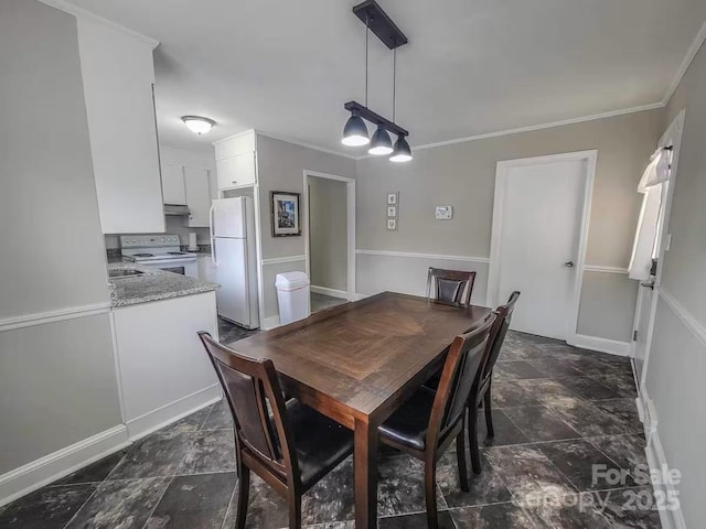 dining space with stone finish flooring and ornamental molding