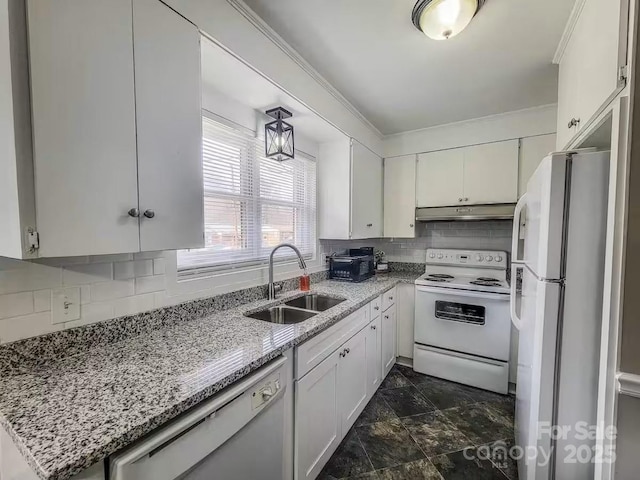 kitchen with white appliances, white cabinetry, a sink, and under cabinet range hood