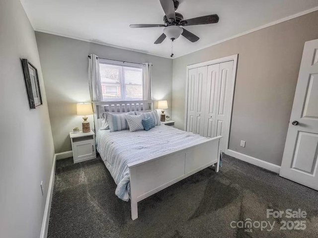 bedroom featuring crown molding, a closet, dark carpet, and baseboards