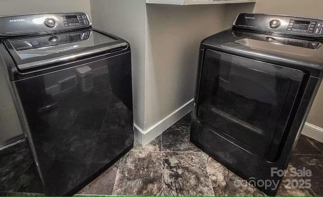 laundry area featuring baseboards