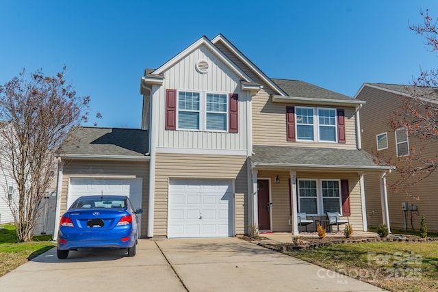 view of front of home featuring driveway, a porch, board and batten siding, and an attached garage