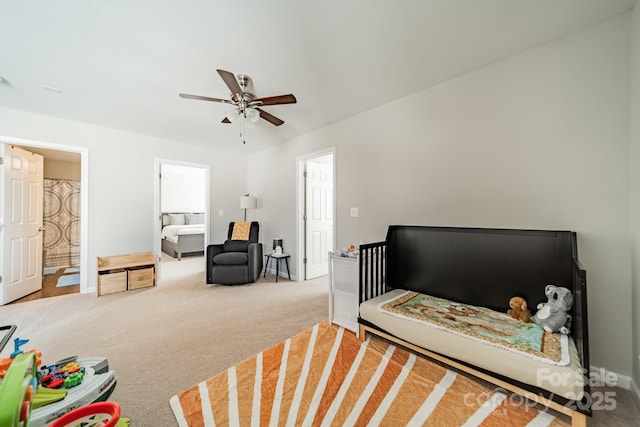 carpeted bedroom with ceiling fan