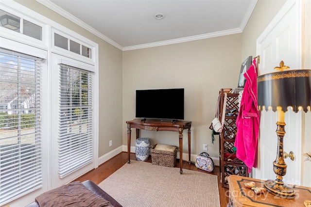 bedroom with ornamental molding, hardwood / wood-style floors, and access to exterior