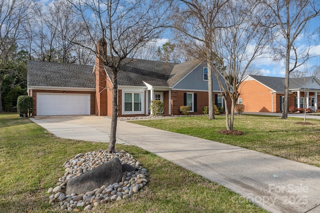 view of front of home with brick siding, an attached garage, a chimney, a front yard, and driveway