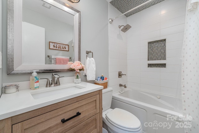 full bath featuring vanity, washtub / shower combination, and toilet