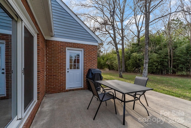 view of patio featuring outdoor dining area and grilling area