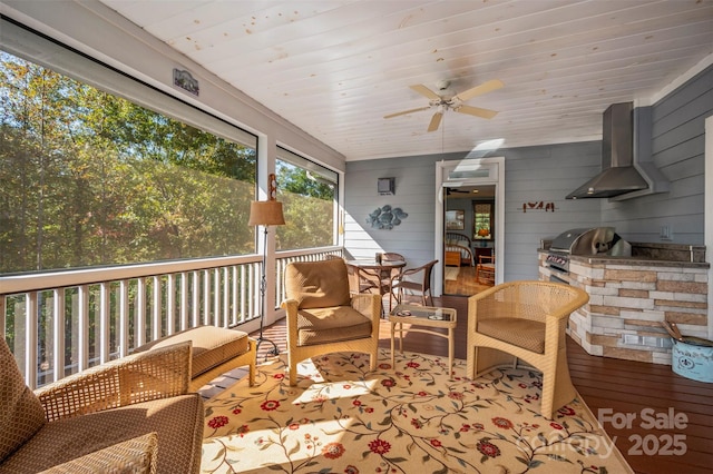 sunroom / solarium with wooden ceiling and ceiling fan